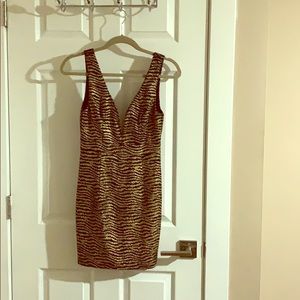 Gold and black mini dress.